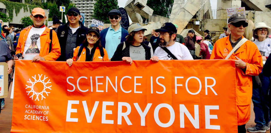 March for Science banner says "Science is for Everyone" held by Academy staff