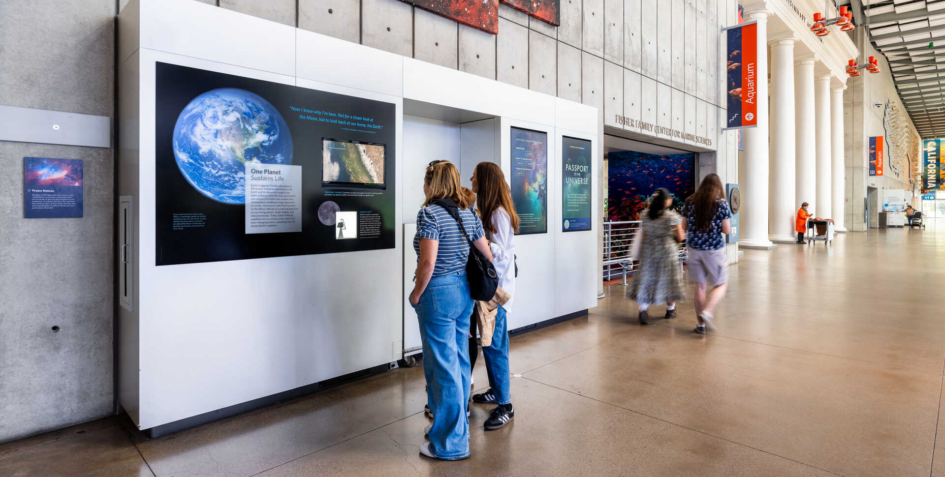 Academy guests looking at the Moon rock display