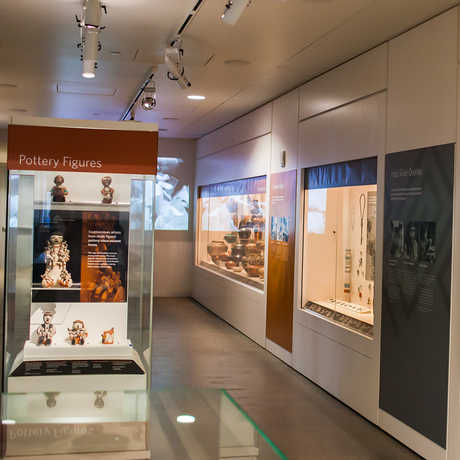 Image of the Evolving Traditions gallery, showcasing pottery, jewelery, and more.