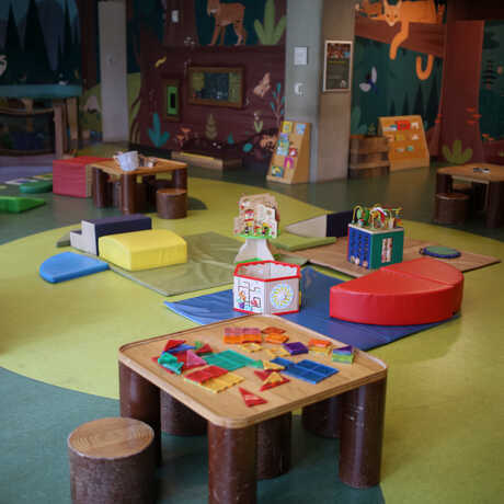 Inside Curiosity Grove at the Academy, with kid-friendly activities on display