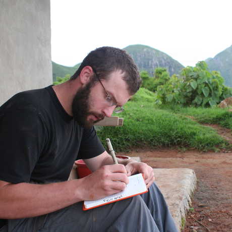 Dave Blackburn in the field taking notes