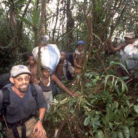 Fisher treks through the jungle with local guides 