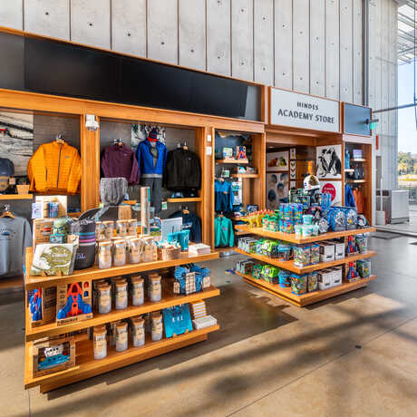 Exterior view of the Academy Store with merchandise displays in the lobby