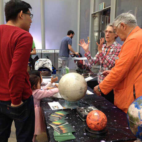 Academy Docents answer astronomy questions from visitors.