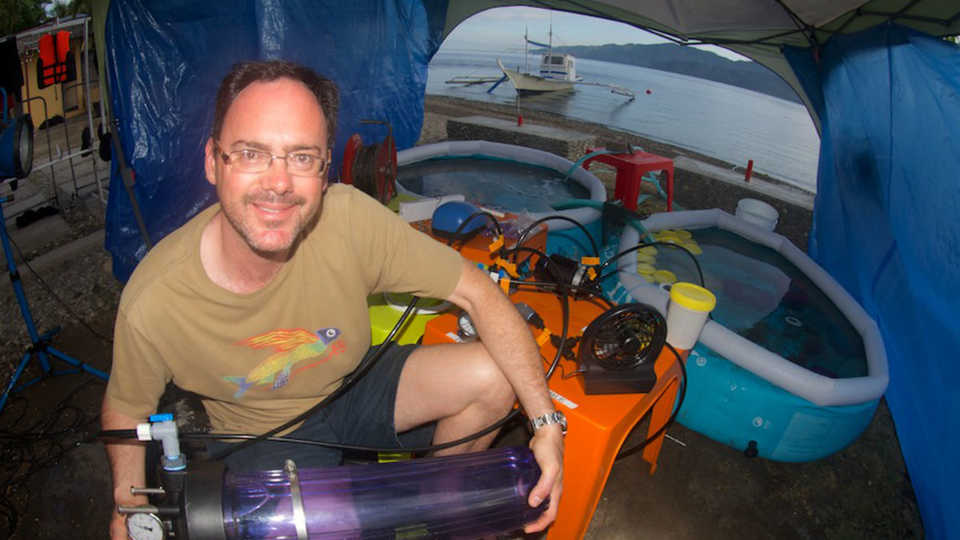 Bart Shepherd holds a hyperbolic chamber for fish in the Philippines