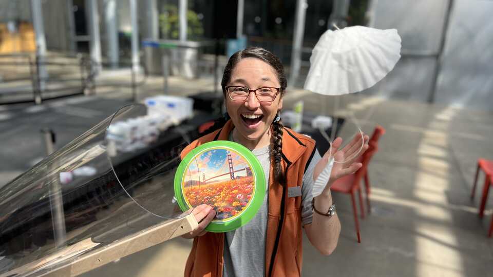 Public Programs Presenter demonstrating flight lab